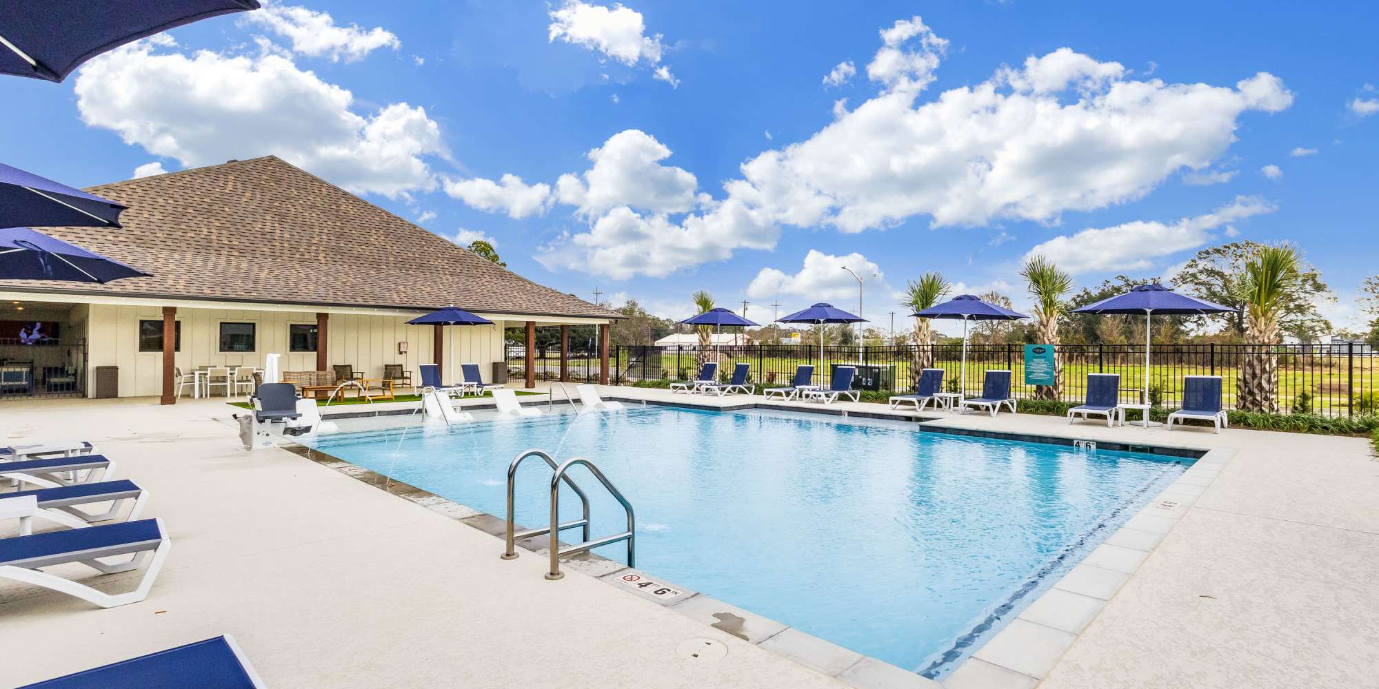 Resort-style swimming pool at Cottages at Creekview in Lafayette, Louisiana