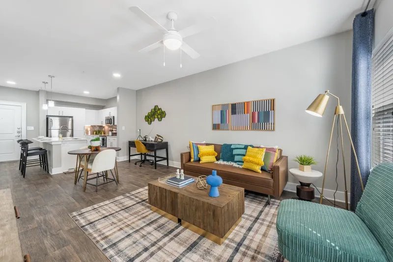 Furnished living room with couch with view of kitchen
