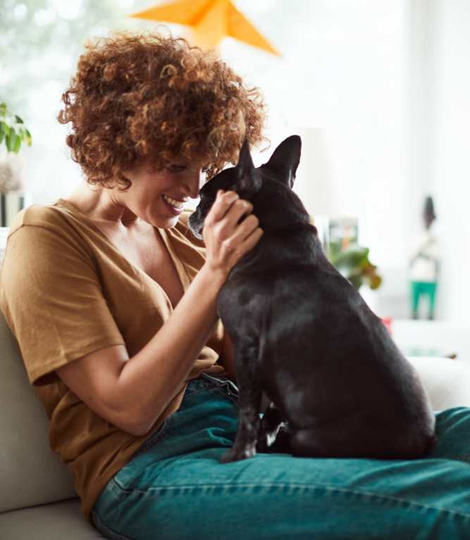 Resident playing with her dog at Mosby Barclay West in Wilmington, North Carolina