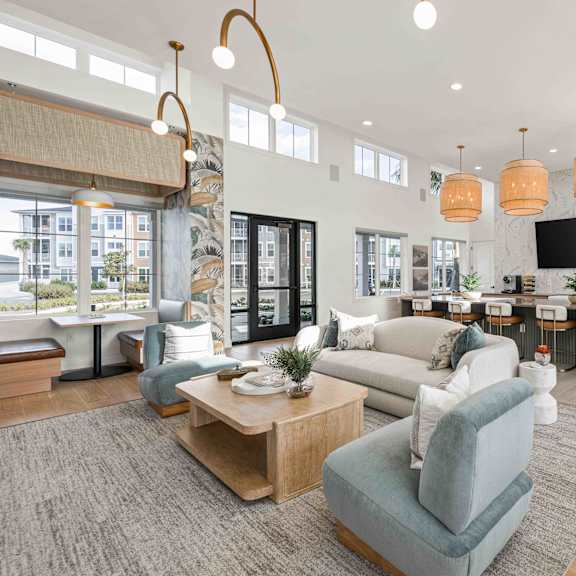 a pool table in a living room with a painting on the wall at Verity Luxury Apartments, Vero Beach, FL 32960