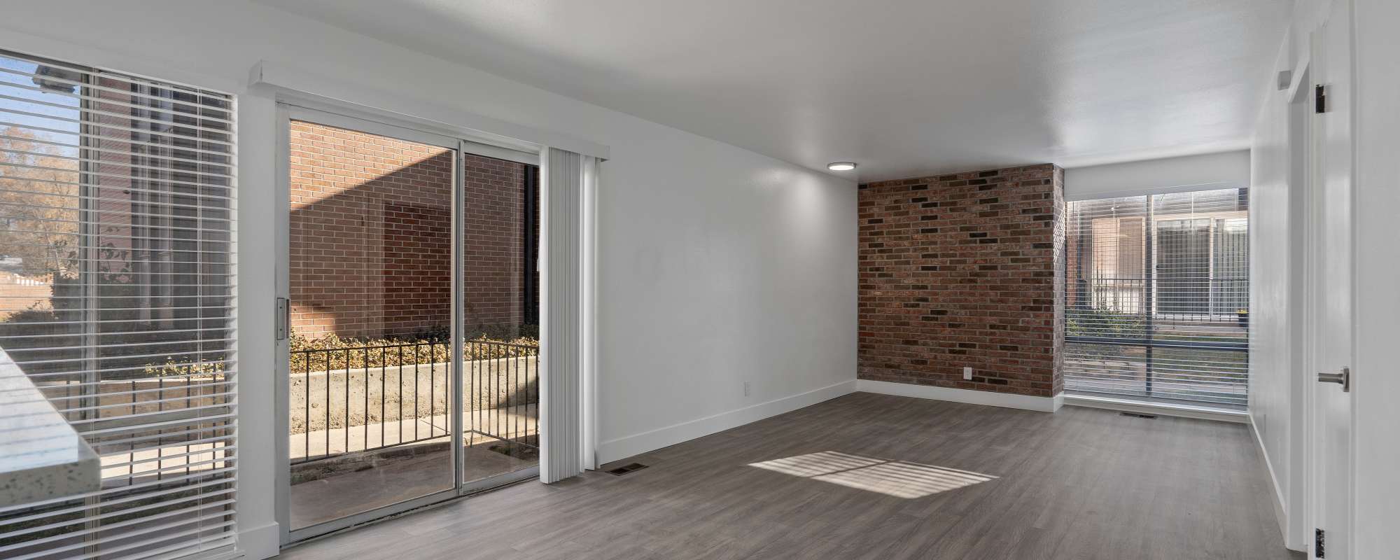 Model kitchen leading to living space at The Franklyn Apartments in Millcreek, Utah