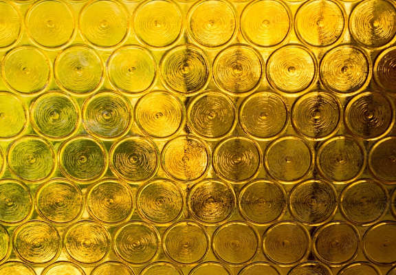 a wall of wine glasses filled with gold liquid at Montage West Lafayette Apartments, West Lafayette, IN, 47906