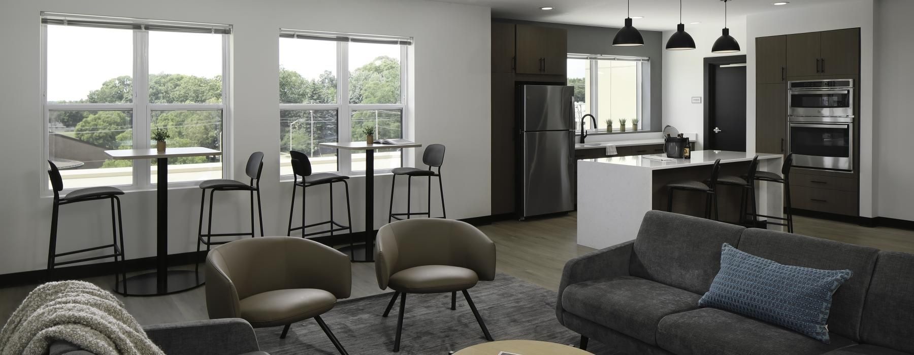 a lounge with a couch and chairs