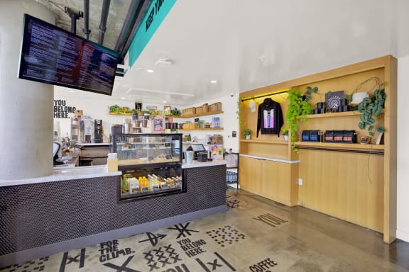 the lobby of a coffee shop with a counter and a tv at the perch, California, 90065