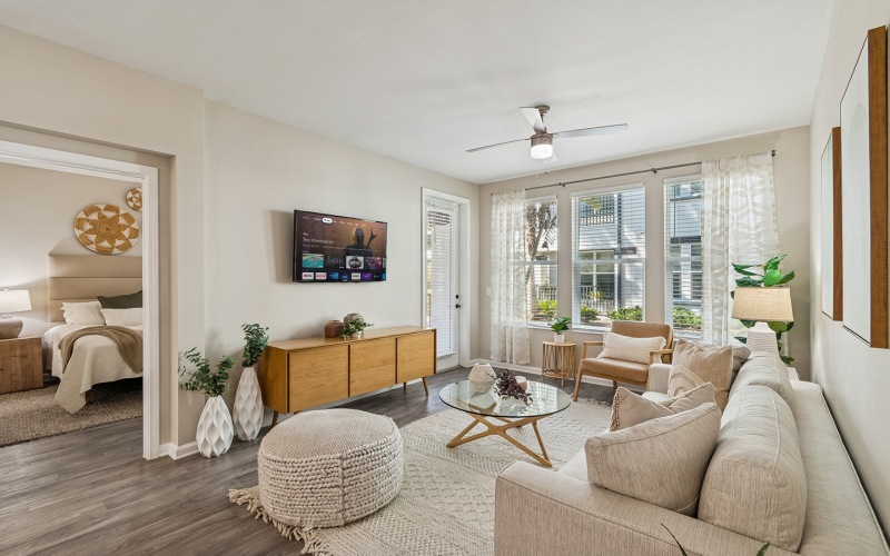living room couch and chairs with table and tv Amelia at Westshore FL luxury apartments for rent