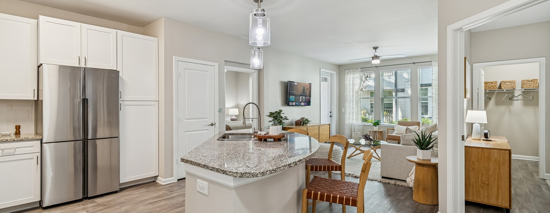 kitchen island and living room Amelia at Westshore FL luxury apartments for rent