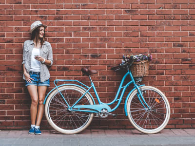 Resident standing next to her bike at Wythe Apartment Homes in Irving, Texas