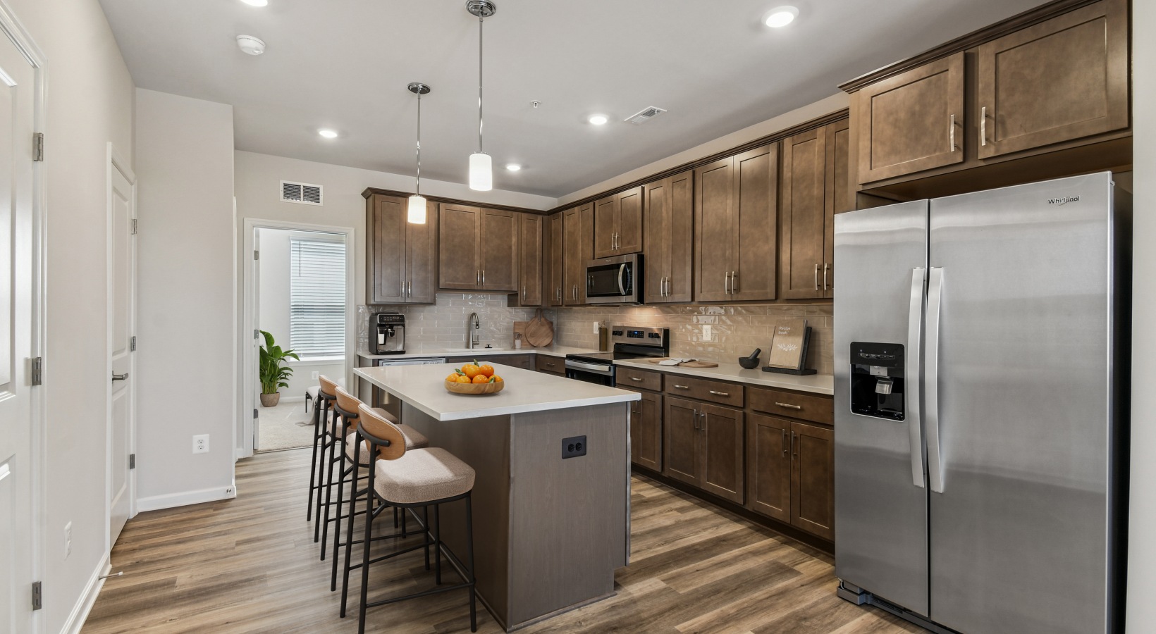 Kitchen with island and bar stool