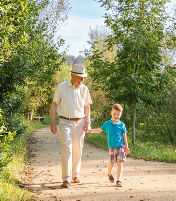 Man walking in park with a child  at 1104 Residences, Antioch, TN