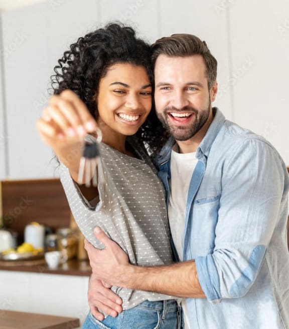 Couple hugging and smiling at 1104 Residences, Antioch