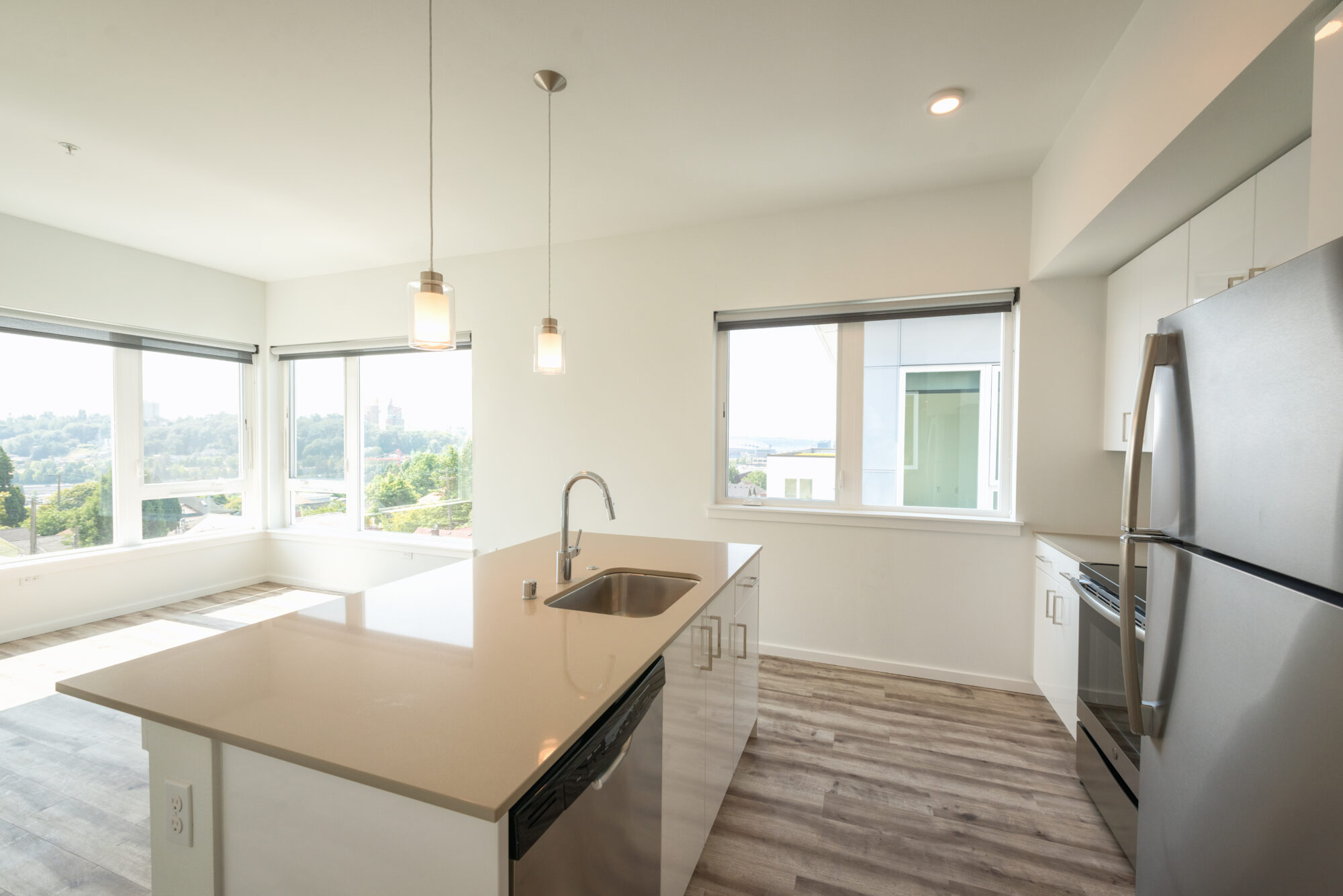 Kitchen with stainless steel appliances and tile backsplash