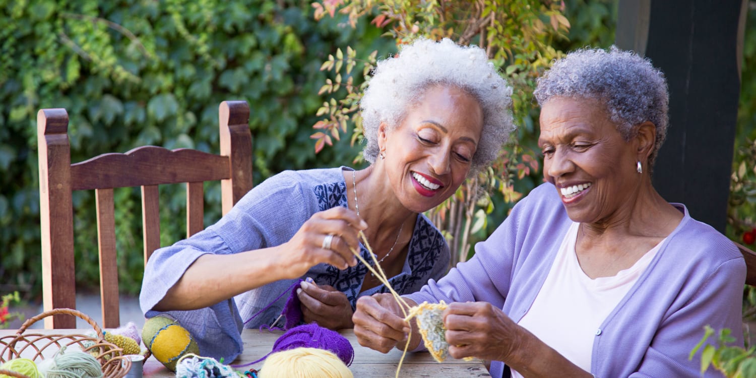 Residents knitting outside at Gilfield Park in Charlotte, North Carolina