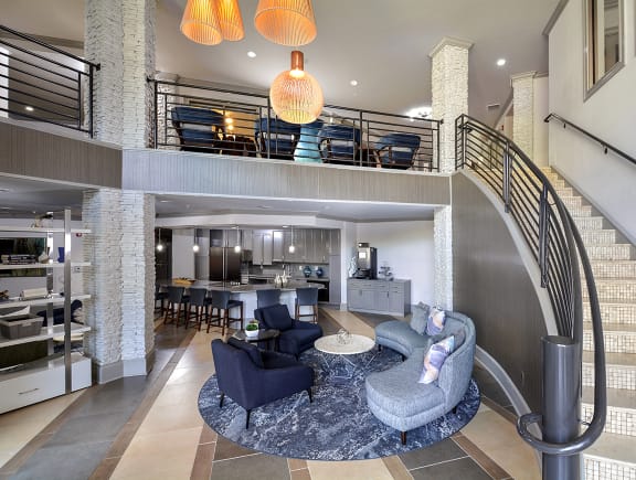 Seating area and bookshelves in newly renovated clubroom at The Tribute in Raleigh, 27612