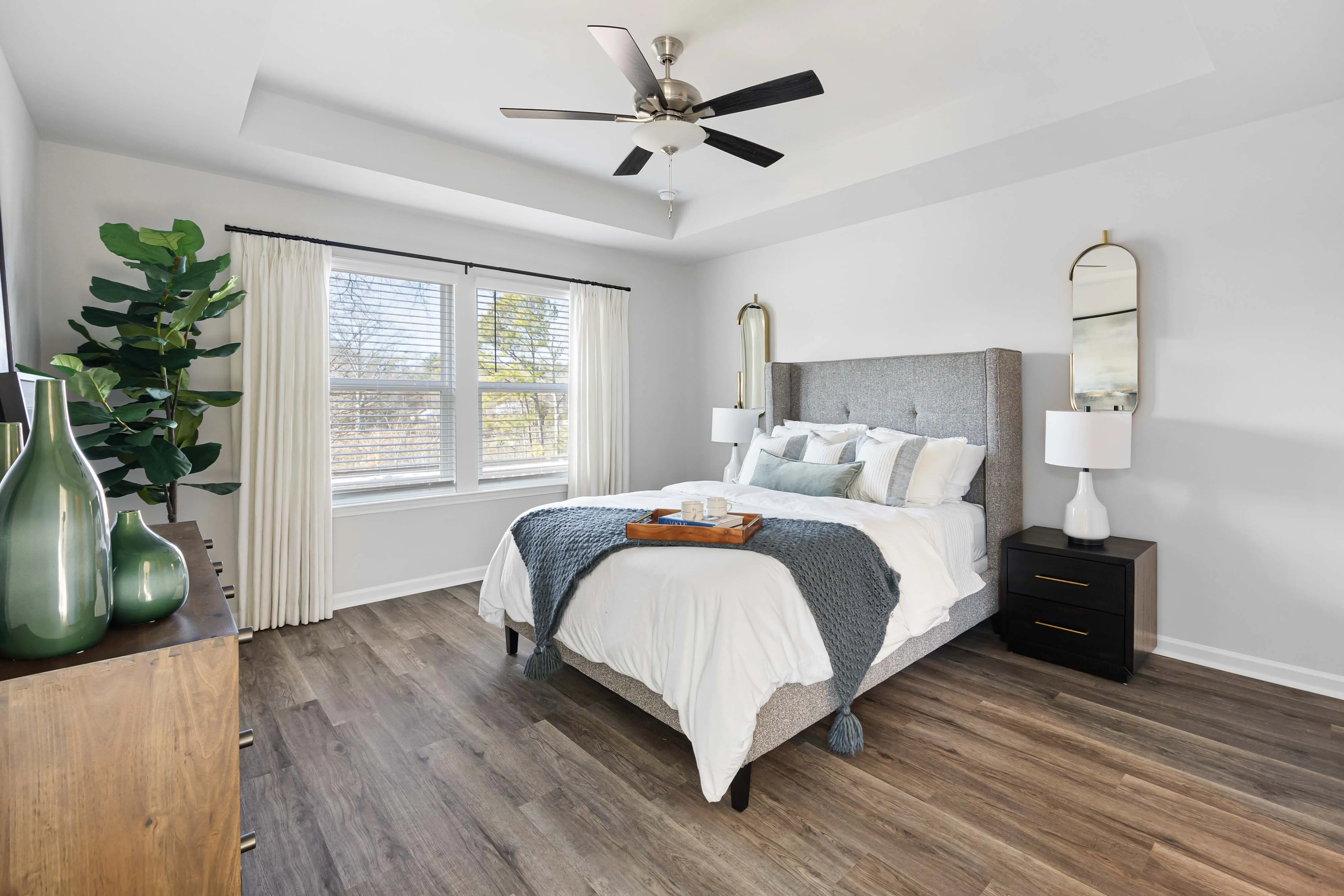 main bedroom with wood style flooring
