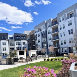 Exterior view of the Hathon's apartment complex in the spring