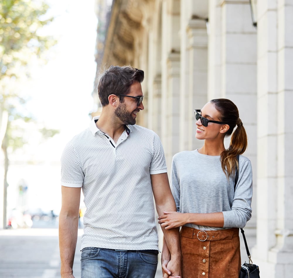 Couple walking around town near MV Apartments in Mountain View, California