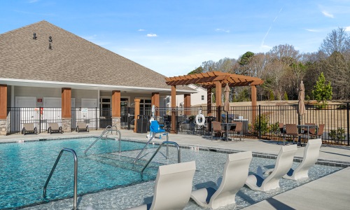 pool with sunshelf, cabanas and grilling area