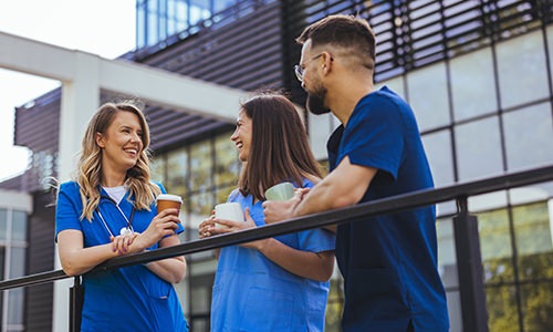 three nurses talking