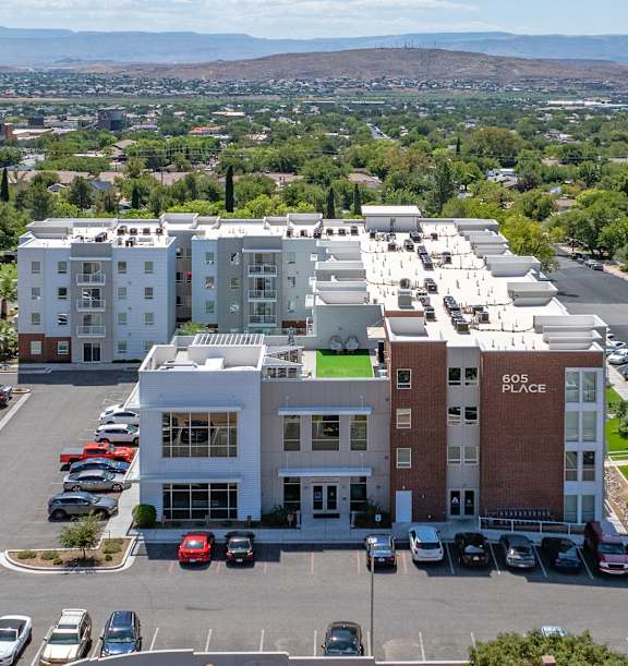Aerial view showing apartment and cars at 605 Place Student Housing & Co-Living, Utah