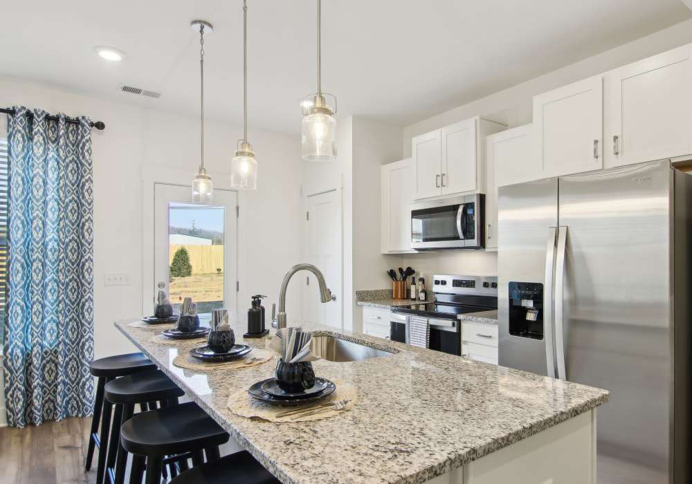 Kitchen with center island at Artisan Living Mills River in Mills River, North Carolina