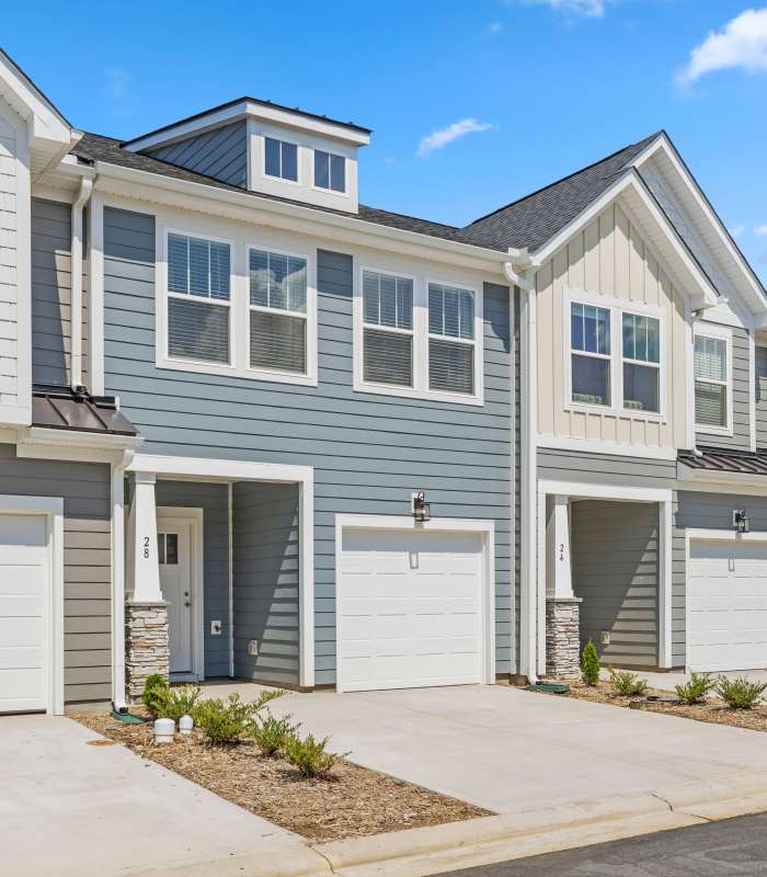 Townhome Exterior View with Garages at Artisan Living Mills River in Mills River, North Carolina