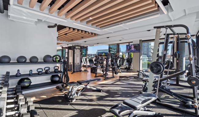 fitness center with ample equipment and modern decor