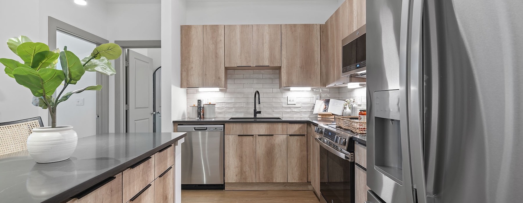 a kitchen with wood cabinets