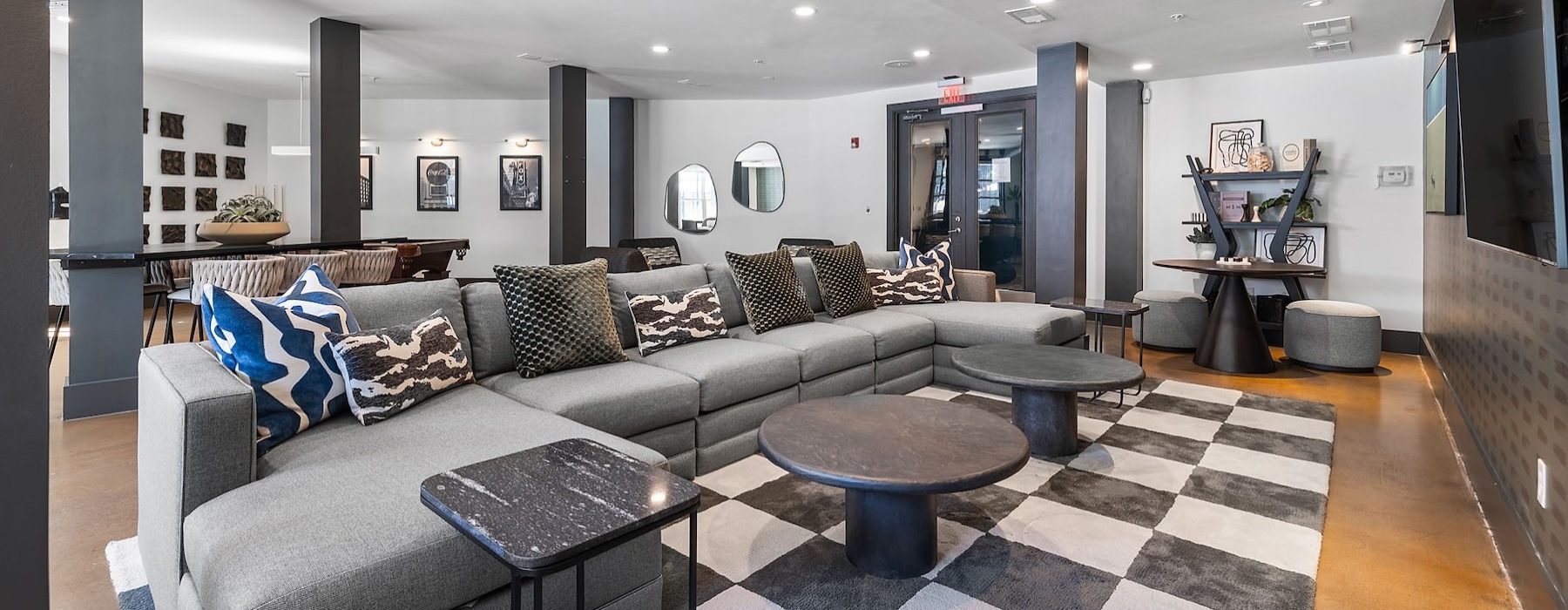 a clubroom with a couch and a tv