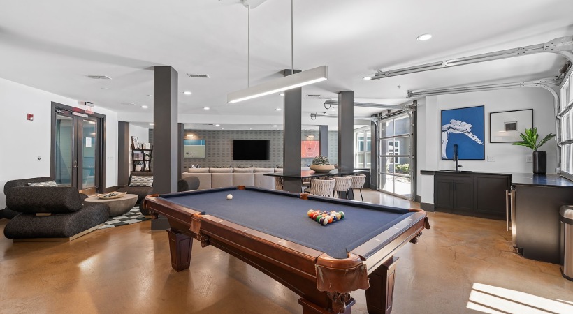 a clubroom with a pool table