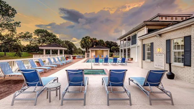 pool and apartment building at dusk