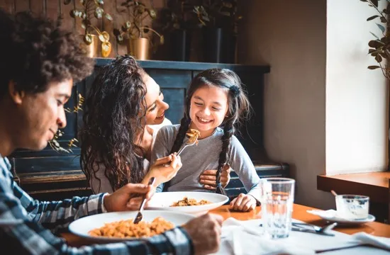 family eating at dining table