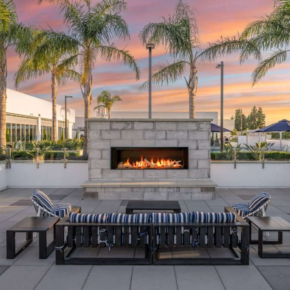 Outdoor fire pit area with seating at The Beacon in Fremont, California