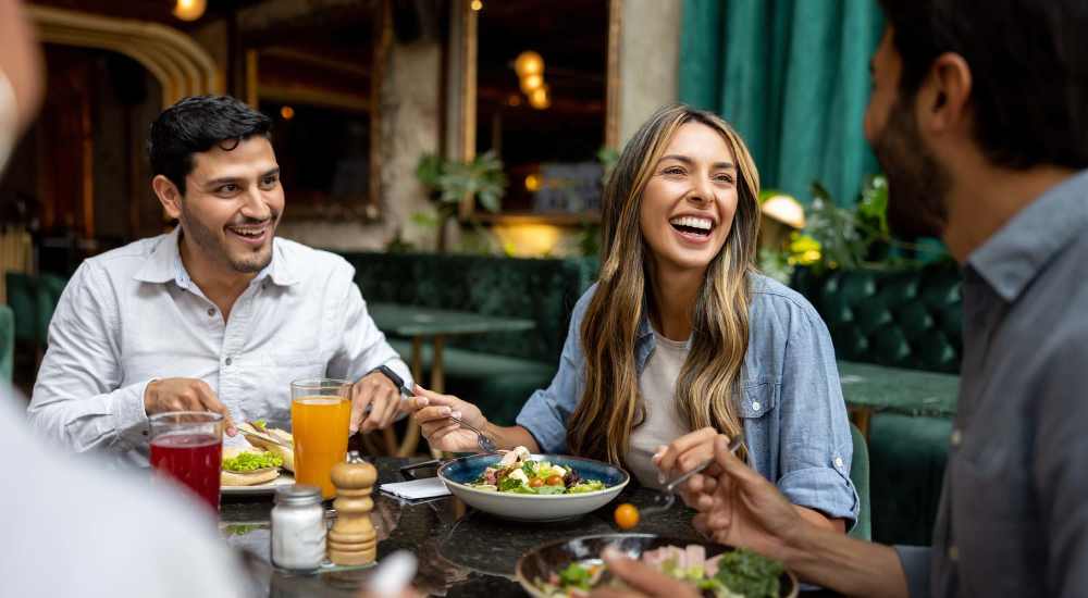 Residents with friend having food near The Beacon in Fremont, California