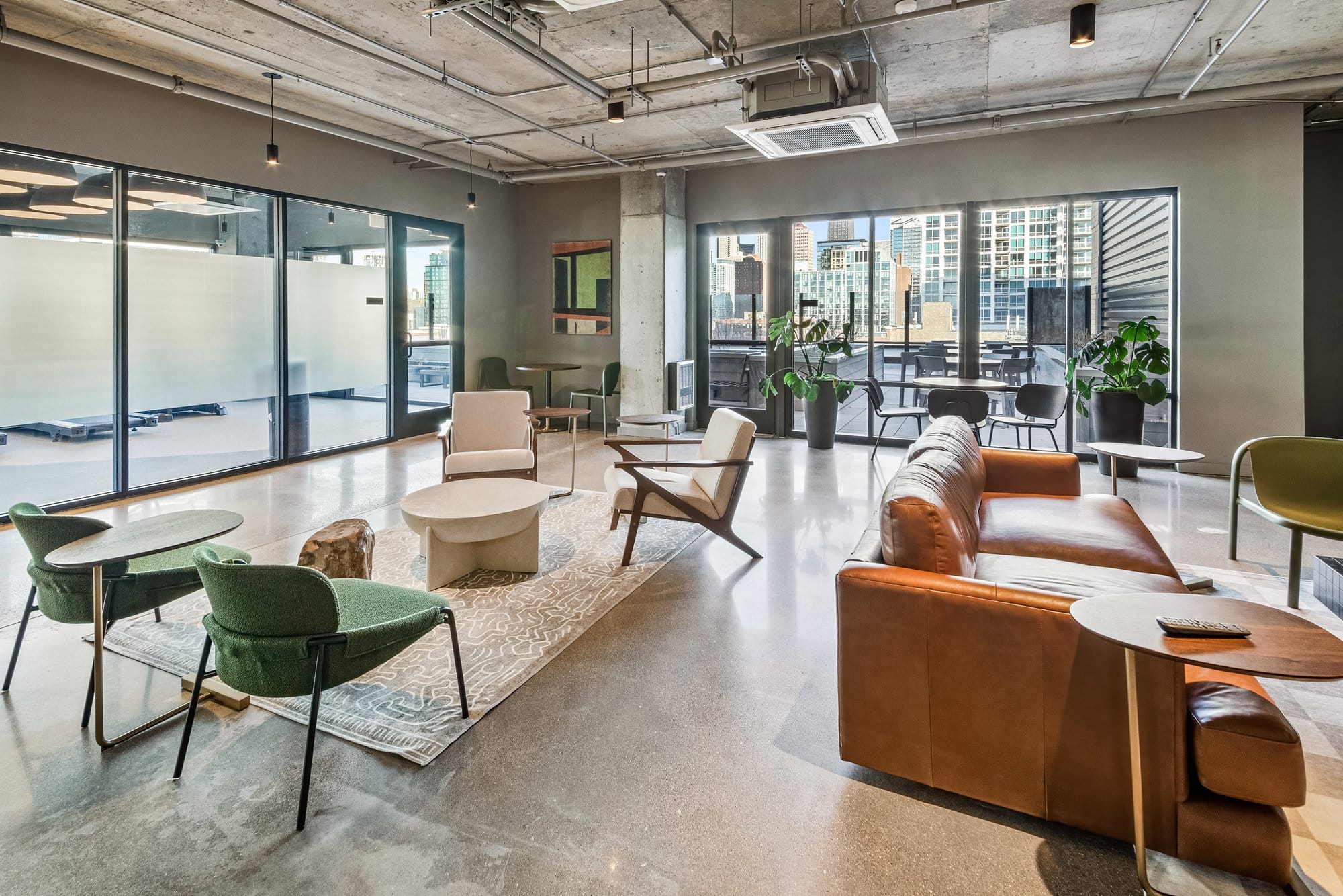Resident lounge with seating and city views
