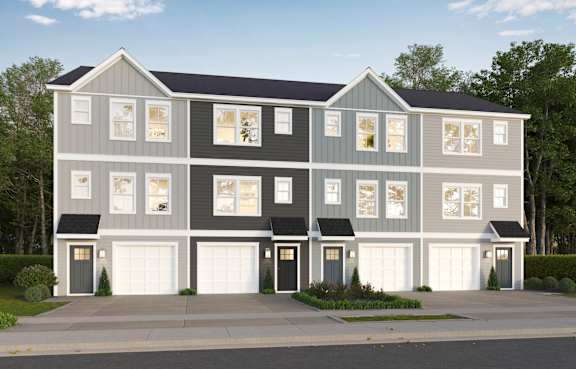 A two-story house with a grey exterior and white trim.