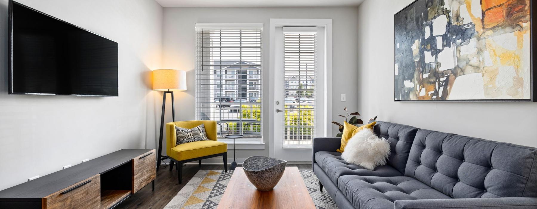a living room with a couch and a table