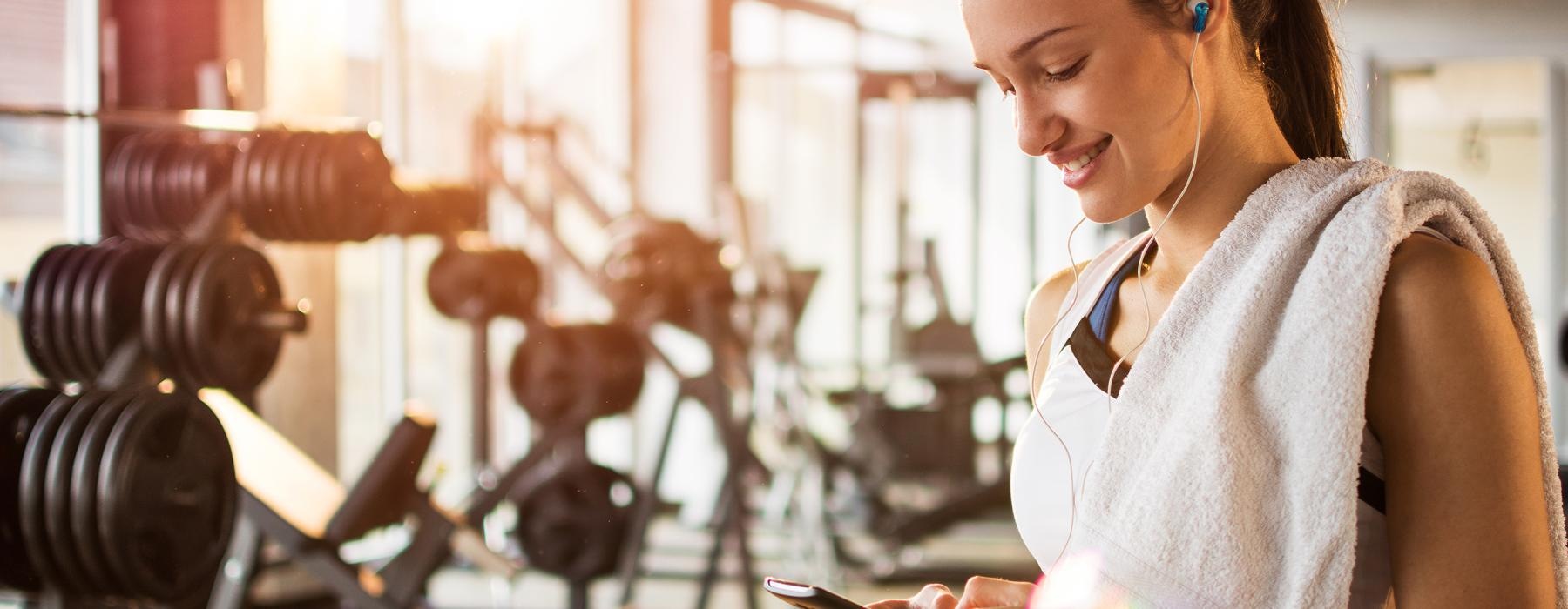 a person using a phone in a gym