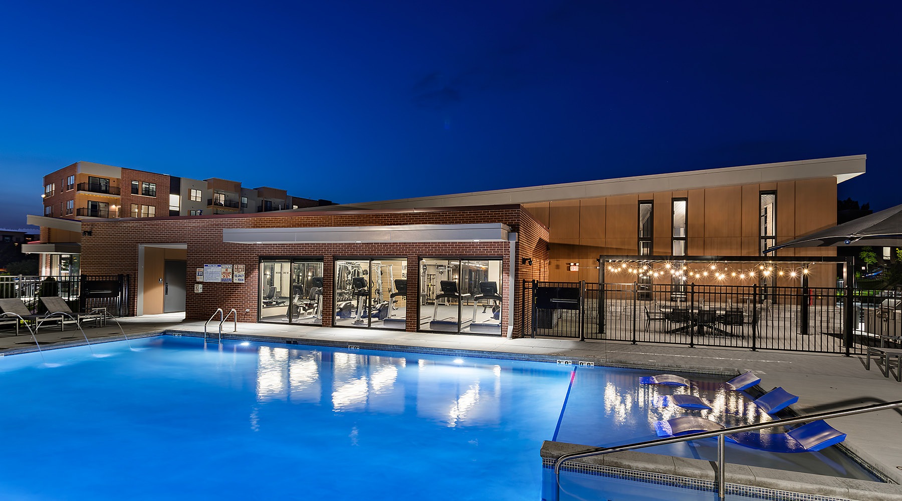 outdoor swimming pool lit at night