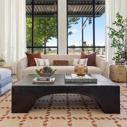 room with couch chairs and large window