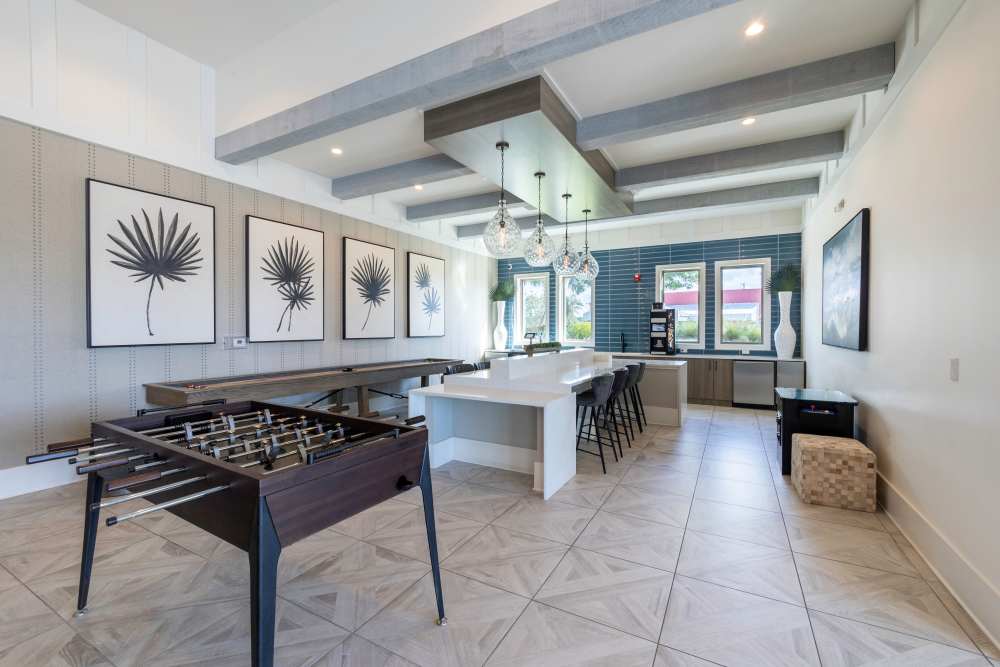 Community area with foosball table at Indigo Champions Ridge in Davenport, Florida