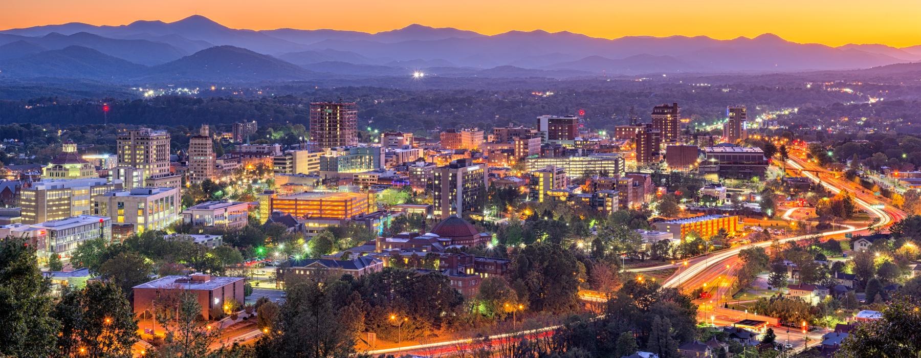 a city with mountains in the background