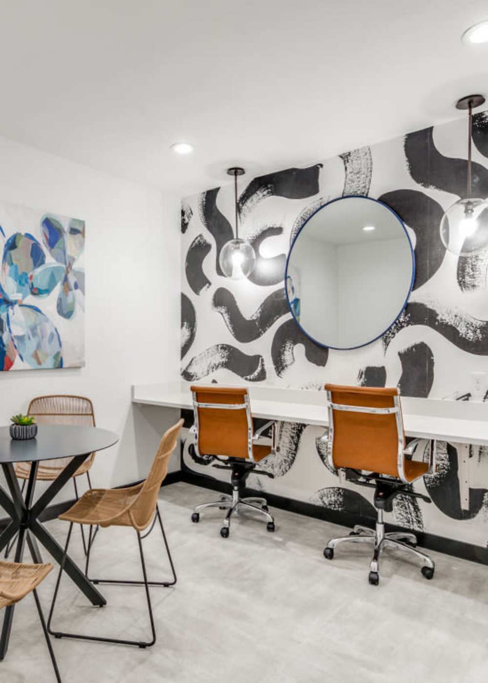 Business center with wall art at Emmitt Luxury Apartments in Haltom City, Texas