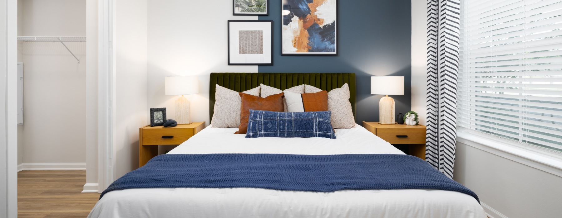 a bedroom with a bed and two nightstands