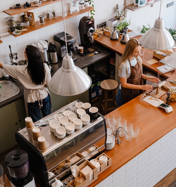 Baristas working at a local coffee shop counter