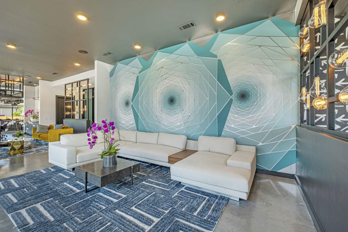 Clubhouse sitting area with mural at  Maverick in Atlanta, Georgia