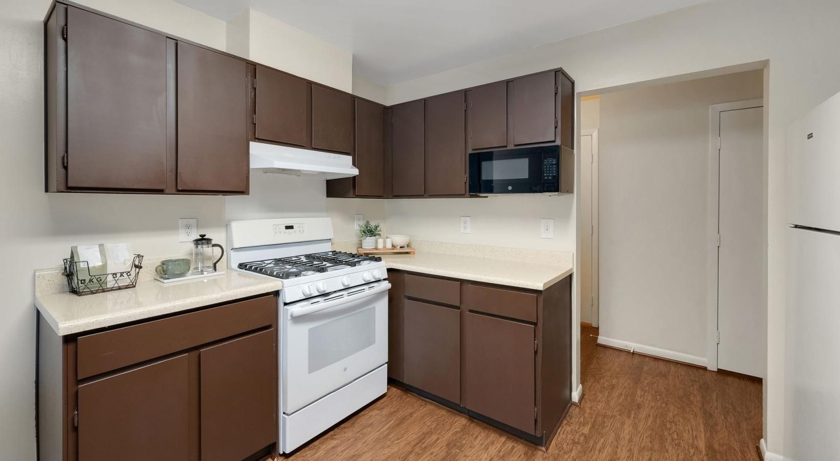 a kitchen with wooden cabinets