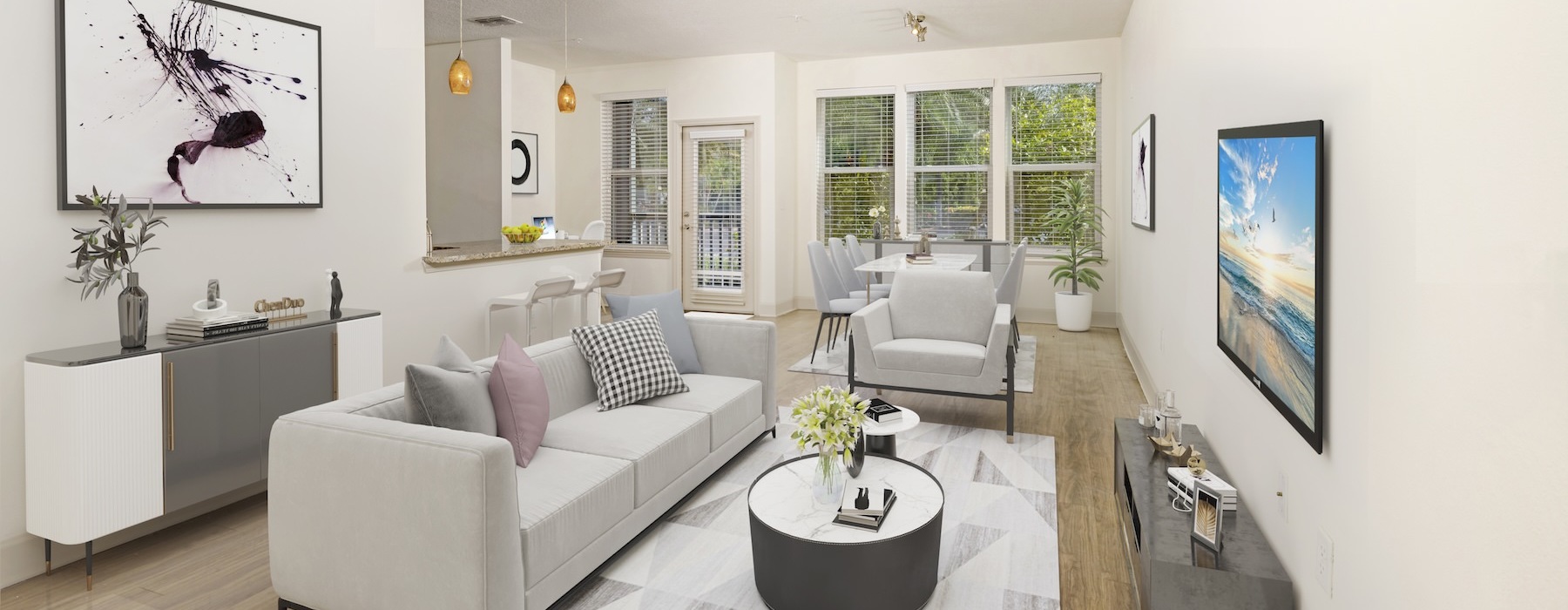 a living room with a white couch and a white table