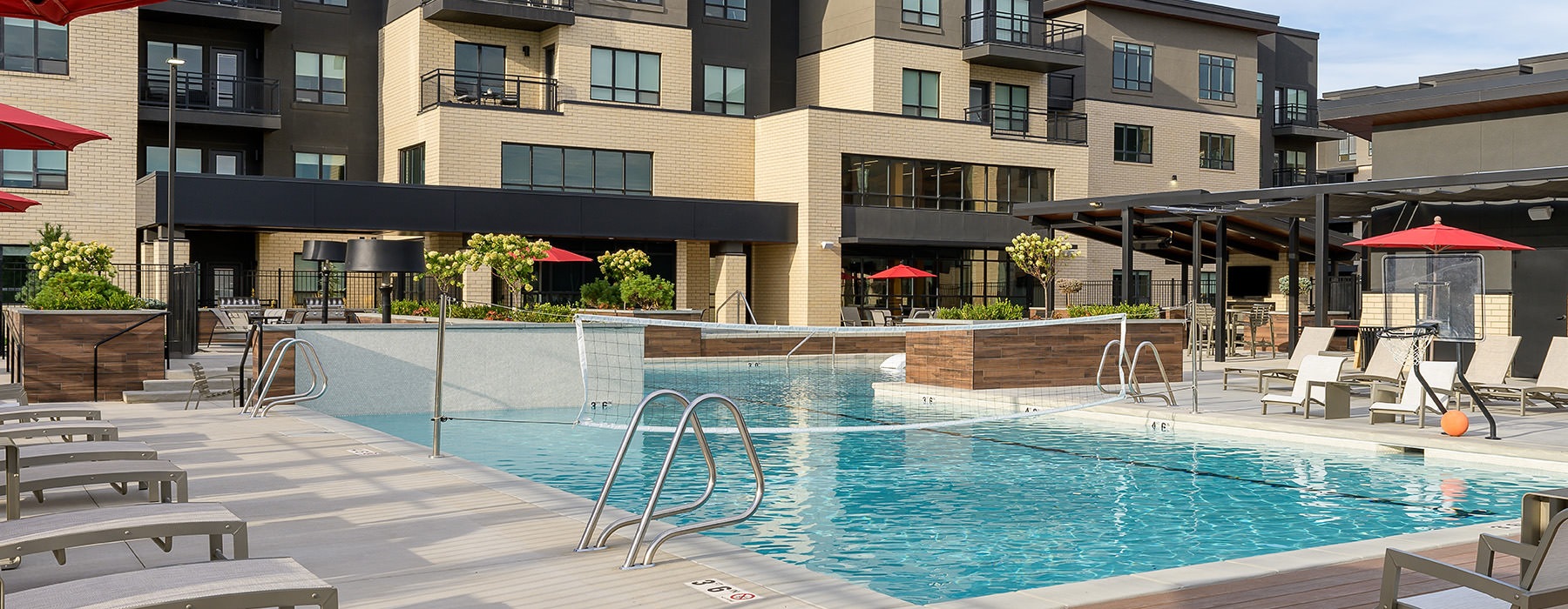 pool with chairs and umbrellas
