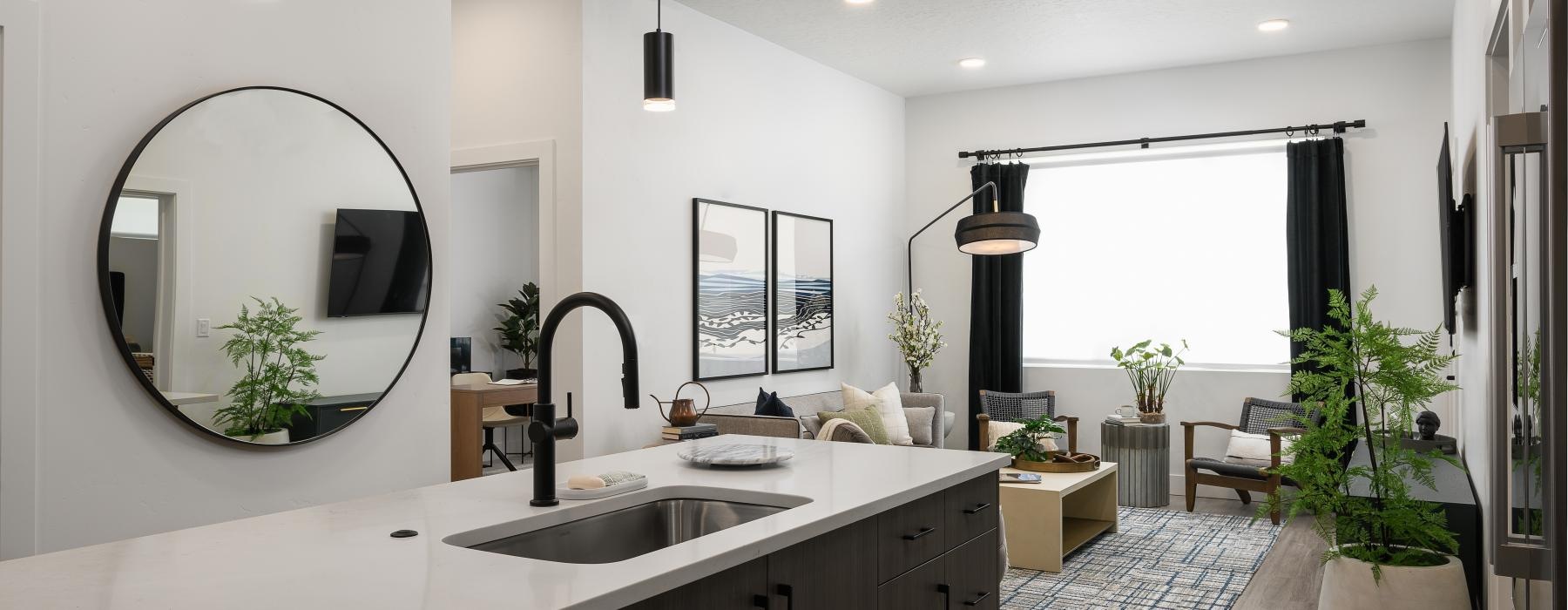a modern kitchen with a large mirror