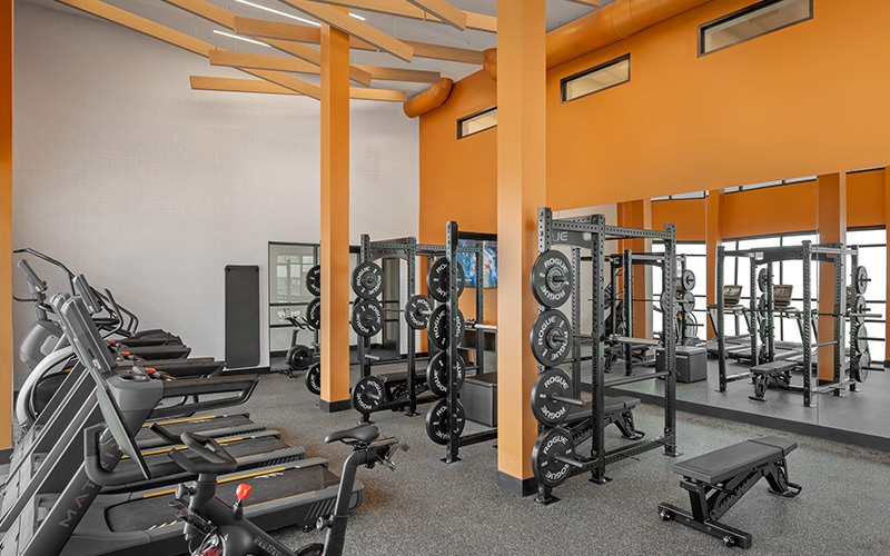 room with orange wall and exercise equipment